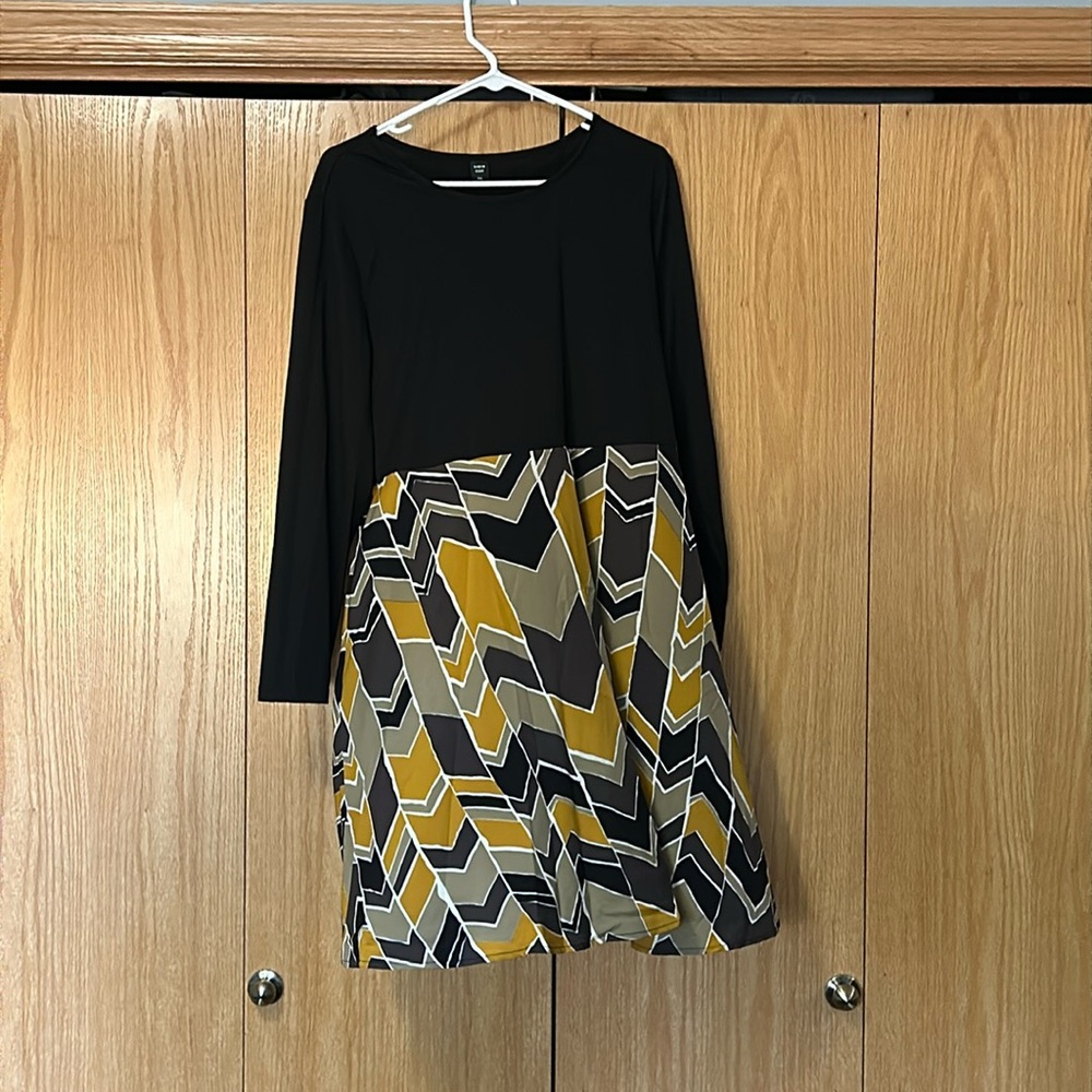 It has never been worn before. It’s a 2XL.